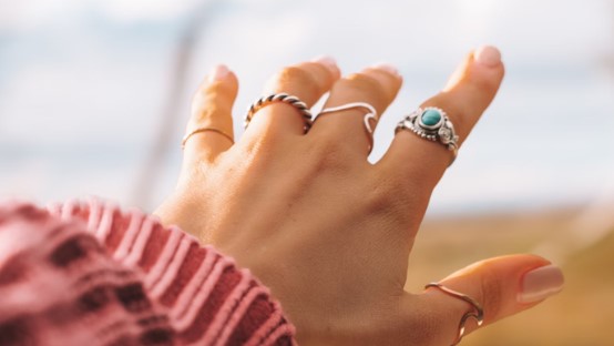 a hand wearing a ring